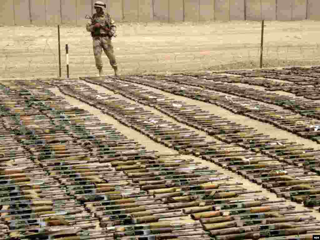 Improving security in Iraq - Weapons seized by Iraqi security forces during recent operations in the Shi'ite enclave of Sadr City are on display at the 9th Iraqi Army Division headquarters in southeastern Baghdad, Iraq on Wednesday, 18 June 2008