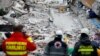 ALBANIA -- A rescue dog searches for survivors in a collapsed building in Durres, after an earthquake shook Albania, November 28, 2019