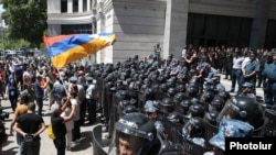 Armenia - Riot police guard a government building during an opposition demonstration in Yerevan, May 31, 2022.
