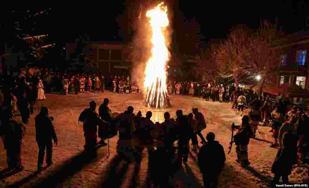 Costumed people perform a traditional dance during Surva carnival celebrations&nbsp;in the Bulgarian village of Elovdol.&nbsp;