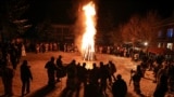 Costumed people perform a traditional dance during Surva <strong><a href="https://www.rferl.org/a/bulgaria-traditional-masquerade-festival/32245656.html" target="_blank">carnival celebrations</a></strong>&nbsp;in the Bulgarian village of Elovdol.&nbsp;