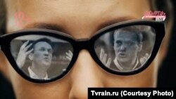 Russian opposition campaigner Aleksei Navalny is reflected in the sunglasses of socialite and presidential hopeful Ksenia Sobchak. (photo illustration)