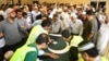 The coffin of Santa Fe High School shooting victim Sabika Sheikh, 17, is carried during a memorial service in Stafford, Texas. Her remains were later transferred for burial in Pakistan. 