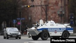 A police armored vehicle patrols a street in the Armenian capital of Yerevan on March 25.