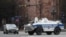 A police armored vehicle patrols a street in the Armenian capital of Yerevan on March 25.
