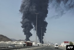 Smoke rises from the direction of an energy installation in the UAE port of Fujairah on March 14.