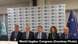World Uyghur Congress President Dolkun Isa (center) and top WUC leaders at a news conference following the announcement of his reelection in Prague on November 14.