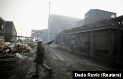 A miner emerges from underground at the Sretno (Good Luck) mine near Breza.