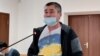 Activist Orynbai Oqasov in court on November 16.