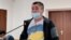 Activist Orynbai Oqasov in court on November 16.