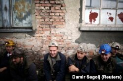 Bosnian miners prepare for a shift in Breza's Sretno mine, just north of Sarajevo. The mine employs 1,100 people in the town of 14,000.