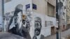 Natën ndërmjet 16 dhe 17 nëntorit, 2021, autorë të panjohur kanë shtuar te murali i të dënuarit serb për krime lufte, Ratko Mlladiq, edhe muralin e komandantit çetnik të Luftës së Dytë Botërore, Drazha Mihajlloviq.