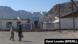 National flags and propaganda posters flown on the streets of a Tajik town near the Afghan border.