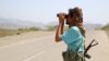 A fighter loyal to Yemen&#39;s Saudi-backed government looks toward Iran-backed Huthi rebels in Yemen&#39;s western province of Hodeida on November 21. The photo is one of several recent pictures captured by photojournalists showing the front lines of the conflict raging today in western Yemen.&nbsp;