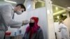A woman takes a free rapid antigen test for COVID-19 at a testing center in Moscow. 