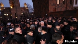 Armenia - Plainclothes main escort renegade priests to the Echmiadzin cathedral of the Armenian Apostolic Church, December 18, 2025.