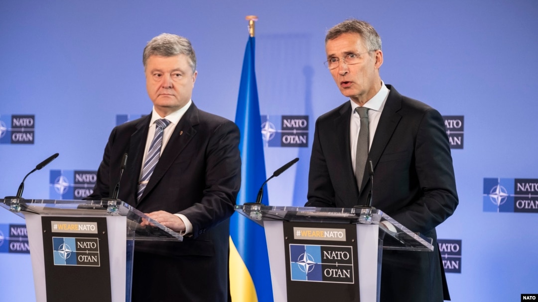 Ukrainian President Petro Poroshenko (left) and NATO Secretary-General Jens Stoltenberg after their meeting in Brussels on December 13. 