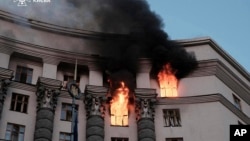 Smoke rises from a fire at Ukraine's Cabinet of Ministers building after a Russian strike on Kyiv on September 7. 