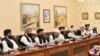 Mullah Abdul Ghani Baradar (third left) leads the Taliban delegation that attended a meeting at the Foreign Affairs Ministry in Islamabad on October 3.