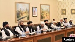 Mullah Abdul Ghani Baradar (third left) leads the Taliban delegation that attended a meeting at the Foreign Affairs Ministry in Islamabad on October 3.