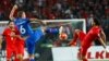 Iceland's Ragnar Sigurdsson (L) fights for the ball with Turkey's Hakan Calhanoglu during their Euro 2016 Group A qualification soccer match in Konya, Turkey, October 13, 2015. REUTERS/Umit Bektas