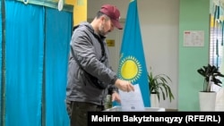 A man votes in a referendum on a new Kazakh Constitution in Almaty on March 15.