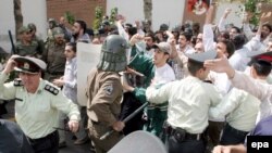 Iran -- Iranian students clash with police and anti-riot forces while trying to attack the British embassy in Tehran, 04Aug2006