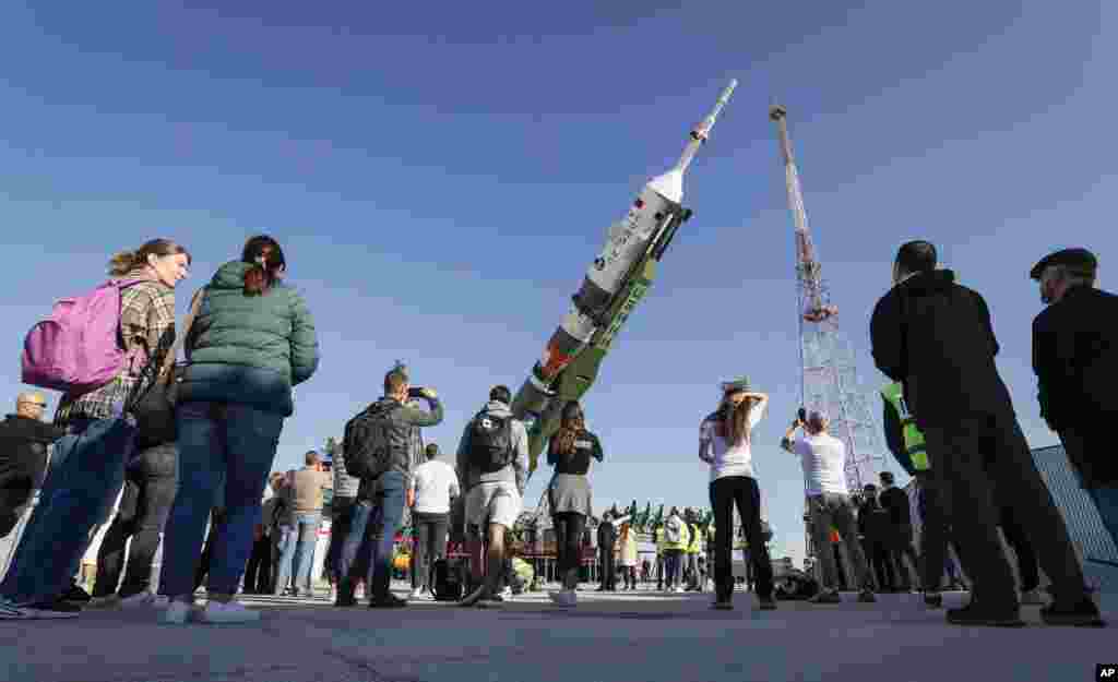 The Soyuz rocket, after being transported to the Baikonur Cosmodrome, is lifted into a vertical position on September 18.