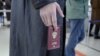 FINDLAND - Ivan, 23, of Russia waits in a queue to have his passport checked at the Vaalimaa border check point in Virolahti, Finland, on September 25, 2022