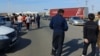 Kazakhstan - People and cars on the border of the Aktobe region of Kazakhstan with the Orenburg region of Russia. 22Sep2022