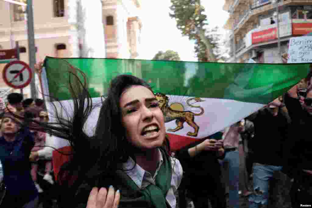 An Iranian woman living in Turkey protested outside the Iranian Consulate in Istanbul on September 21.