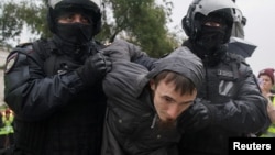 Russian police detain a protester during a rally against the mobilization of reservists ordered by President Vladimir Putin in Moscow on September 24.