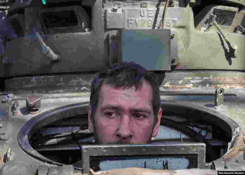 A Ukrainian soldier looks out from a Bradley Fighting Vehicle near the town of Izyum, recently liberated by Ukrainian soldiers, in the Kharkiv region.