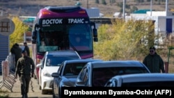 Mongolian border guards check vehicles arriving from Russia at the Mongolian border checkpoint of Altanbulag on September 25.