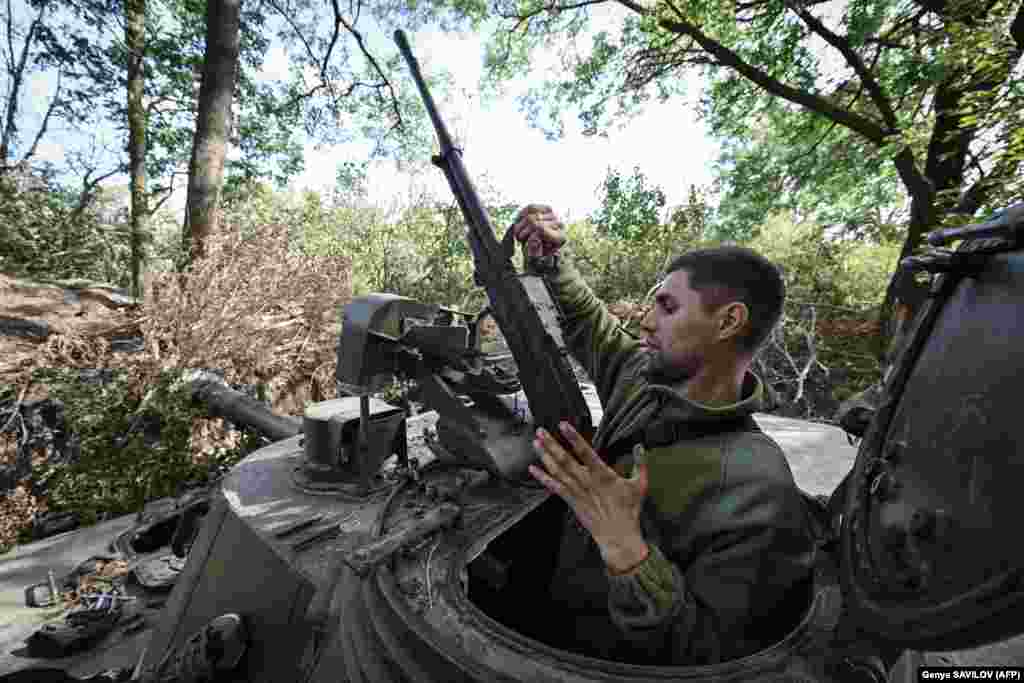 An Ukrainian artilleryman works on a 2S3 Akatsiya self-propelled howitzer in the Mykolayiv region.