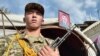 A funeral ceremony is held in Nooken on September 18 for a Kyrgyz soldier killed in the recent clashes.