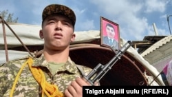 A funeral ceremony is held in Nooken on September 18 for a Kyrgyz soldier killed in the recent clashes.