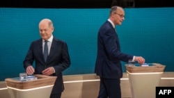 German Chancellor Olaf Scholz (left) and rival Friedrich Merz take part in an election debate on February 9.