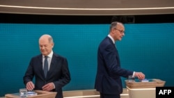 Kancelari gjerman Olaf Scholz dhe kundërshtari i tij konservator, Friedrich Merz. 