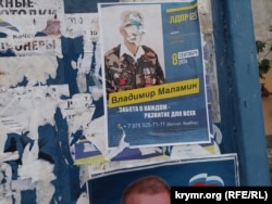 Defaced Russian campaign materials in the Crimean capital, Simferopol, on September 6