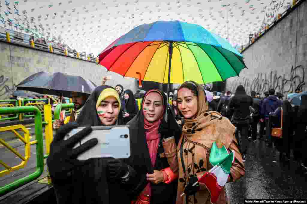 An Iranian woman takes selfies during a ceremony to mark the 40th anniversary of the Islamic Revolution in Tehran on February 11. (Tasnim via Reuters/Vahid Ahmadi)