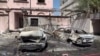 Footage from Bahrain TV on June 11 shows damage to buildings and vehicles in reportedly by debris from an intercepted Iranian projectile.
