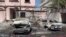 Footage from Bahrain TV on June 11 shows damage to buildings and vehicles in reportedly by debris from an intercepted Iranian projectile.