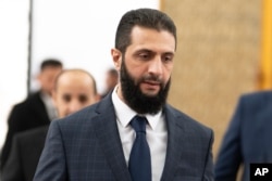 Ahmad al-Sharaa la palatul prezidențial din Damasc, pe 28 octombrie.