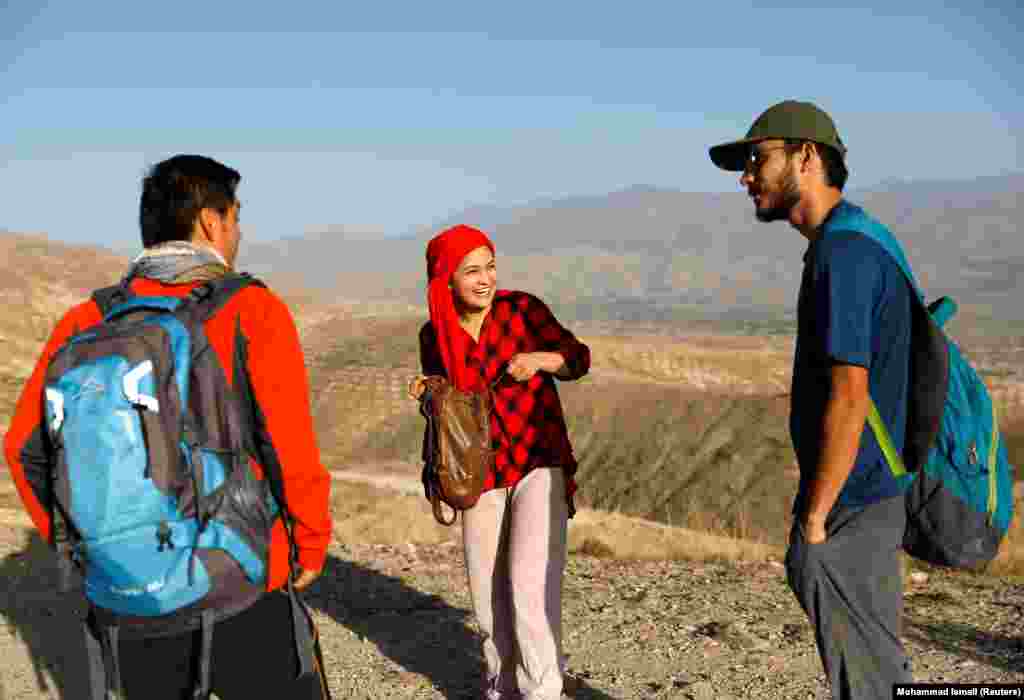 Before the 2021 Taliban takeover: Members of a hiking club chat on a mountain on the outskirts of Kabul in September 2020.Seven months after this image was taken, the Afghan Taliban launched an offensive that ended in August 2021 with NATO and allied troops evacuating and the Taliban seizing power in the country.