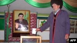 A man casts his ballot in Turkmenistan's parliamentary elections on December 14.