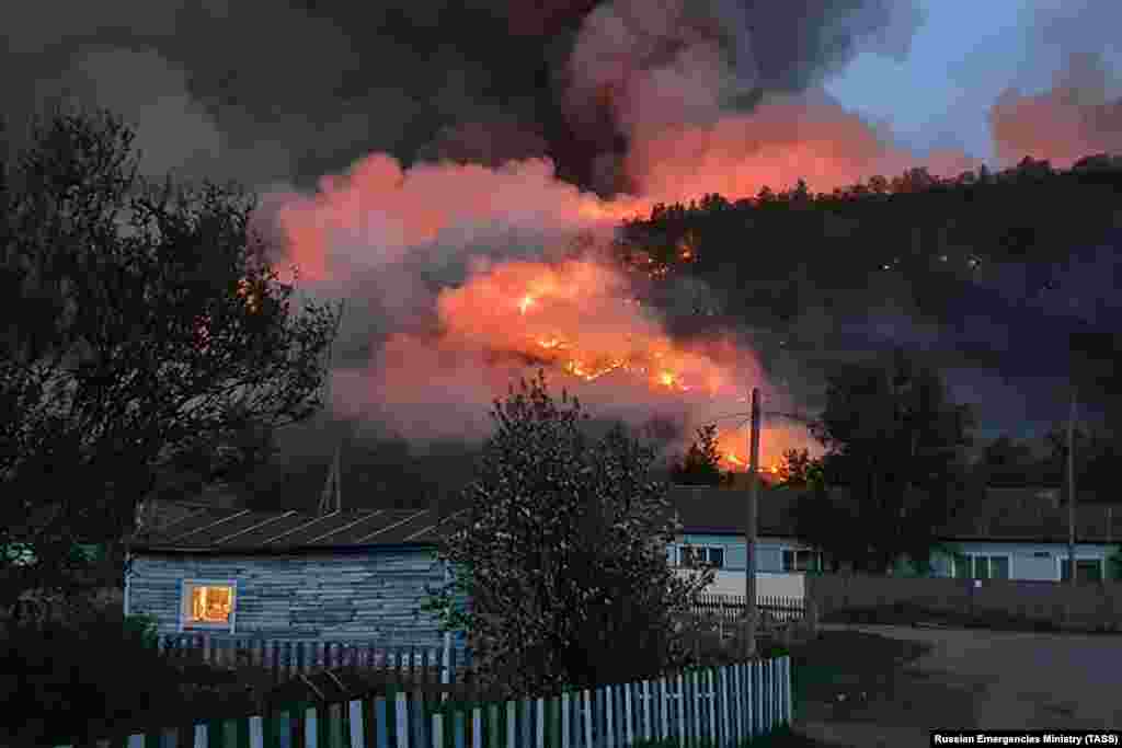 A wildfire in a forest near the village of Anavgai in the Bystrinsky district on Russia&#39;s Kamchatka Peninsula. (TASS/Russian Emergencies Ministry)