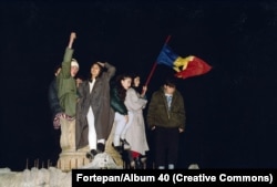 Young Romanians celebrate during the 1989 revolution.