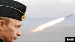 Vladimir Putin watching naval exercises during his last term as president in 2005