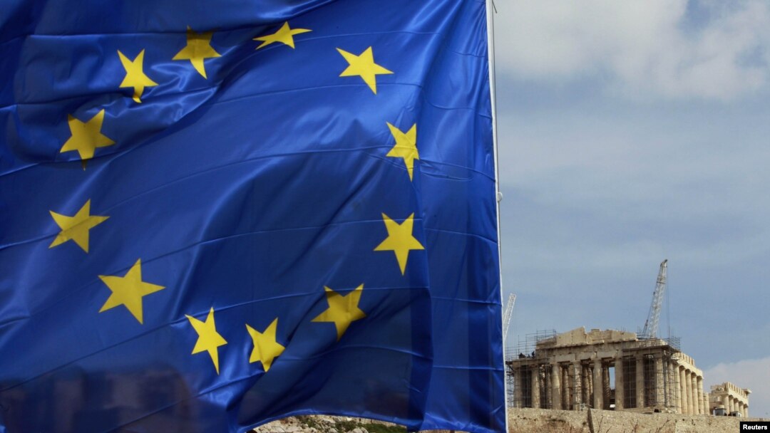 A European Union flag flies in front of the Parthenon temple in Athens